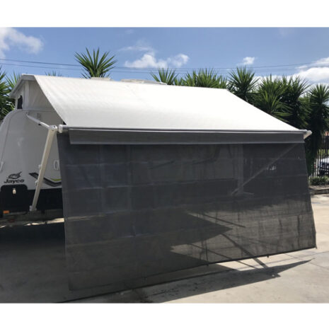 A rv parked in a parking lot with a 3.35m Caravan privacy screen sun shade wall to suit 12ft awning.