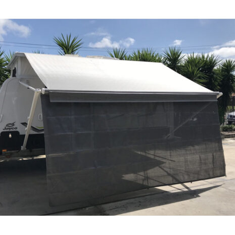A rv parked in a parking lot with a 4.27m Caravan privacy screen sun shade wall to suit 15ft awning.