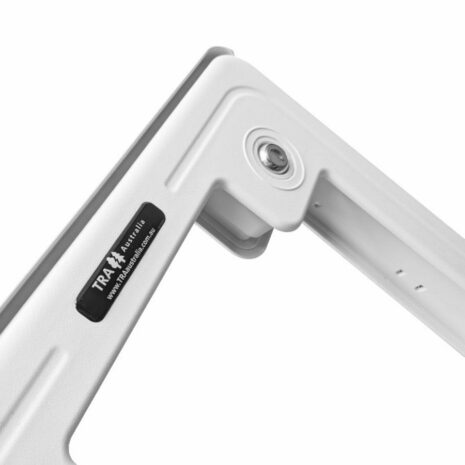 CRSG_20240119_112805951 Close-up of the hinge mechanism of a light gray metallic object with a visible brand label that reads "trak r martin" and includes a push button lock system on a White Caravan Access Service Door (PRE ORDER LISTING – DISPATCH DATE 1st MAY).